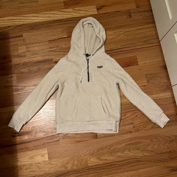 This hoodie is a white teddy zip up jacket with a hood. - Picture 1 of 1